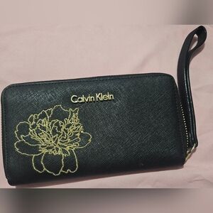 Calvin Klein Black Wristlet with Gold Floral Design NWOT